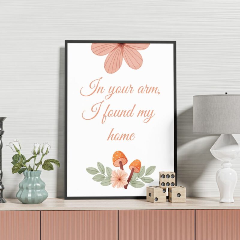Wall frame titled 'In Your Arms, I Found My Home,' showcasing flowers and love, perfect for heartfelt decor.