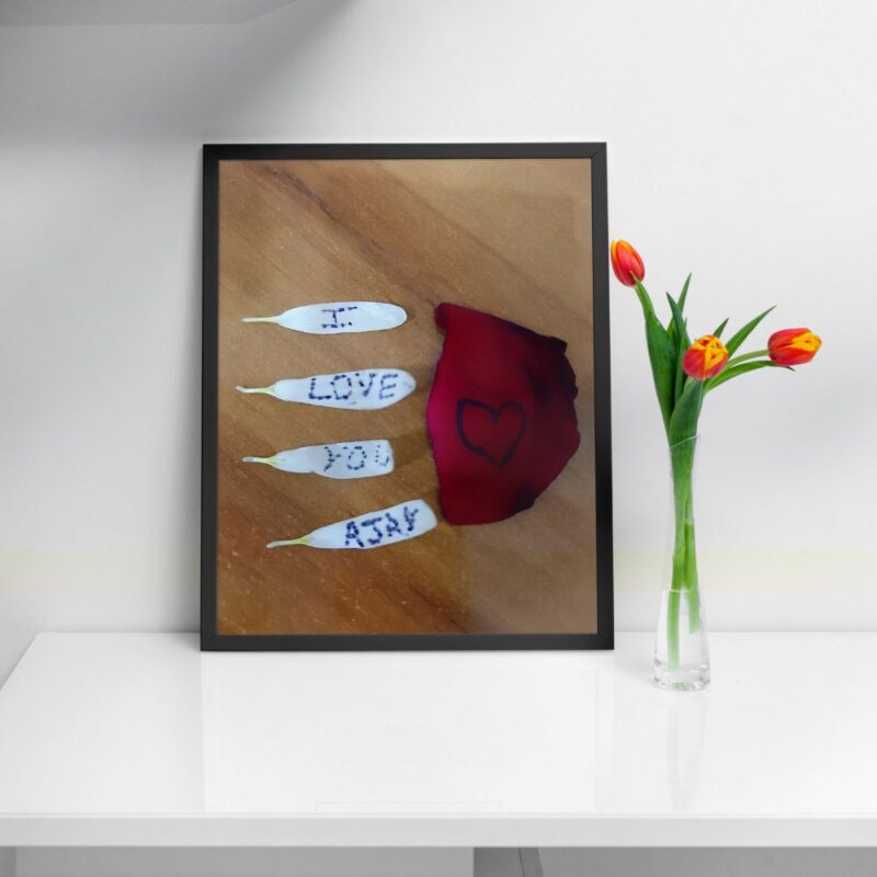 "Personalized wall art featuring a couple embracing with 'I Love You Ajay' inscription."