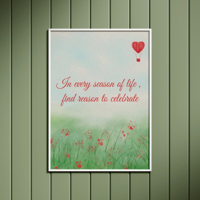 "In every season of life, find reason to celebrate" motivational wall frame with a green background and red floral design, featuring a red hot air balloon in the top right corner.