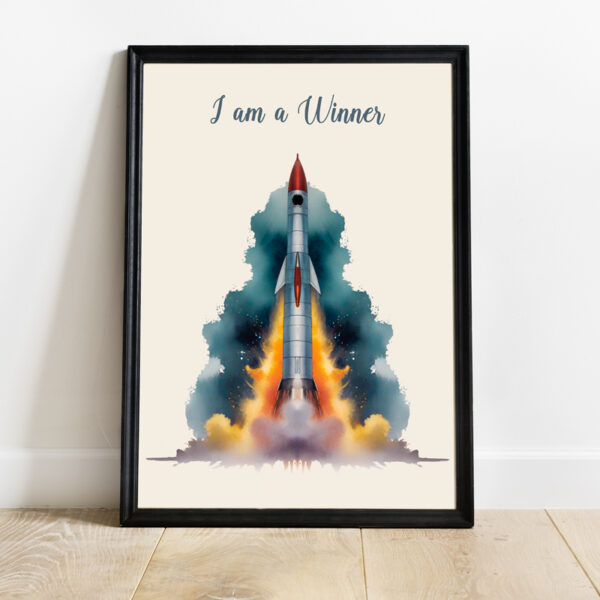 Motivational wall frame with a rocket launching and the text "I am a Winner" in elegant script.